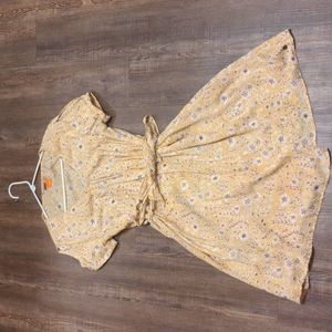 Yellow, flowered wrap sundress